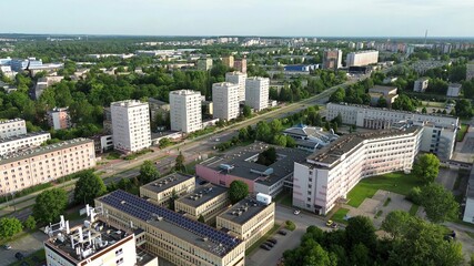 City buildings with mural facades in summer © AlexGo