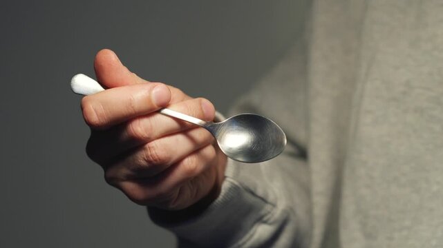 empty poon close up in male hand