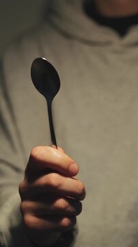 empty poon close up in male hand