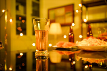 A blurry image of businessmen at a lavish office party.