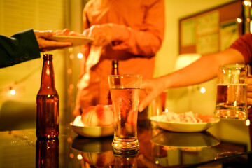 A blurry image of businessmen at a lavish office party.