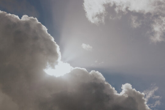 Sunlight streaming through dramatic clouds