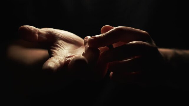 Listing options and bending fingers.
Presenting arguments in a dialogue.
A man clenches his fingers into a fist.