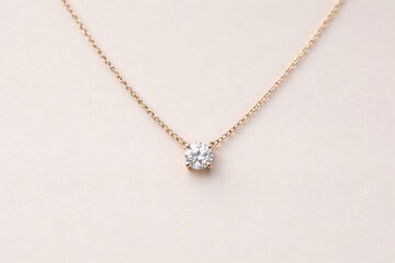 Understated solitaire diamond hanging on a refined delicate chain