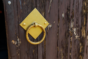 Metal Ring Door Handle on Old Wooden Door