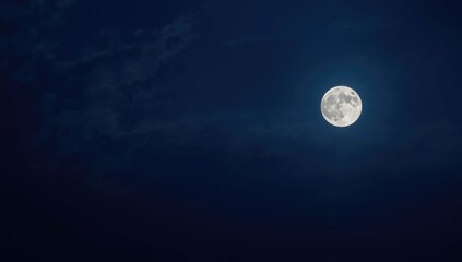 Bright full moon against fragmented white sky, ideal for night scene background, World Night of Arts
