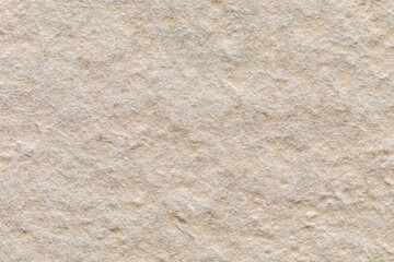 Close-up of the beige surface of the rough gres tile, classified as the highest slip resistance class (R13). 