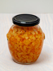 A jar of preserved orange peel in sugar, used as a condiment for cakes and sweets. 