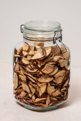 A jar containing delicious homemade dried Asian pear slices.