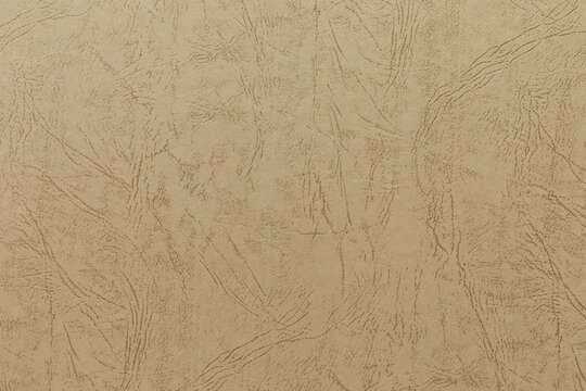 Close-up of an old album's endpaper with vintage marbled paper background, showing its texture. Before mass production in the 20th century, book endpapers often featured paper marbling.