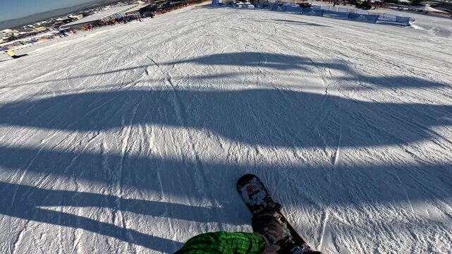 Snowboard run at a ski resort in winter, capturing speed and movement