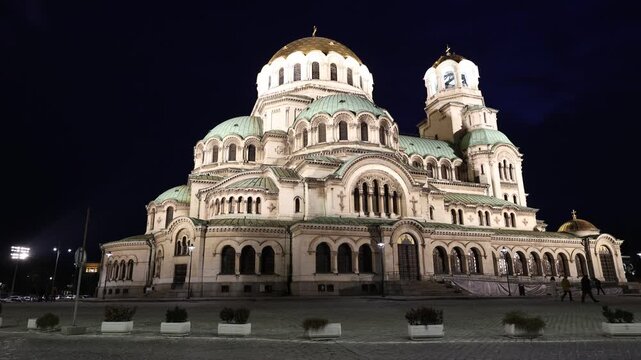 Evening view of the memorial church of St. Alexander Nevsky in the capital of Bulgaria, the city of Sofia. Majestic cathedral with evening illumination against the night sky. High quality 4k footage