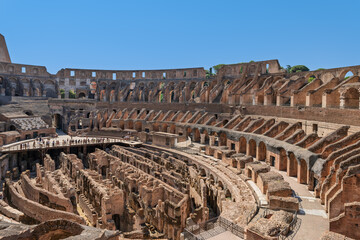 Italy - Rome - Colosseum - Interior panoramic view of the arena floor and tiered seating of the ancient Roman amphitheater ruins. © GuillaumeAngleraud