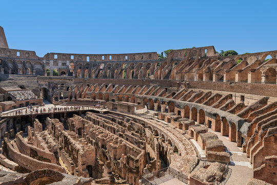 Italy - Rome - Colosseum - Interior panoramic view of the arena floor and tiered seating of the ancient Roman amphitheater ruins.