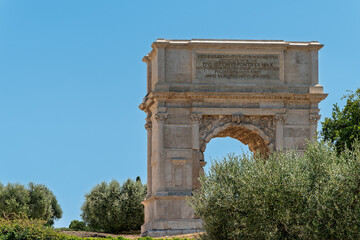 Fototapeta premium Italy - Rome - Arch of Titus - Ancient Roman triumphal arch with marble inscriptions and reliefs standing in the Roman Forum site.