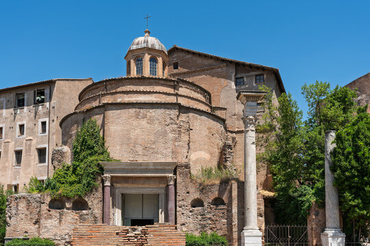 Italy - Rome - Temple of Romulus - Ancient circular building with a domed roof, columns, and an entrance in the Roman Forum ruins site.