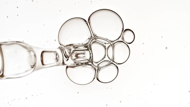 Bubble cluster transparent, cells under a microscope on white background. Gel texture with bubbles, skin care product. Macro Shot of Natural Organic Cosmetics, Medicine. High quality 4k footage