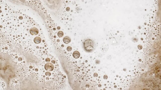 Bubbles of White Soap Foam. Macro Structure Soap Foam close-up. Natural Shampoo Bubbles Motion. Cleanliness, Cleaning Concept, Laundry, Shower. . High quality FullHD footage