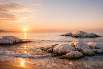 Calm coastal scene with white rock clusters and smooth waves in warm sunrise illumination including copy space