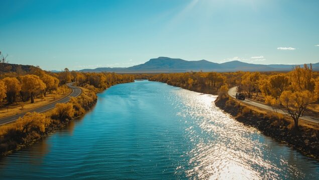 Gibb River Road Pentecost crossing in dry season with water, sky, mountain backdrop, and lush vegetation