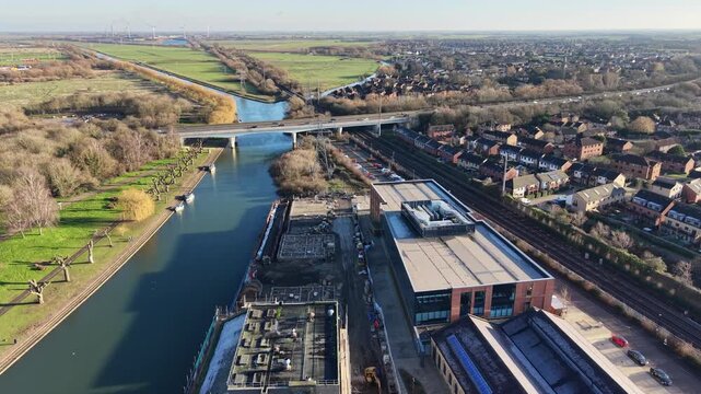 Cars crossing road bridge over River Nene Peterborough Cambridgeshire aerial