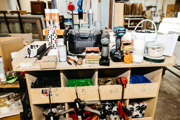 Workbench with professional carpenter tools in workshop