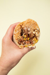 Traditional Mexican Food - Burrito, in hand