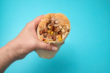 Traditional Mexican Food - Burrito, in hand