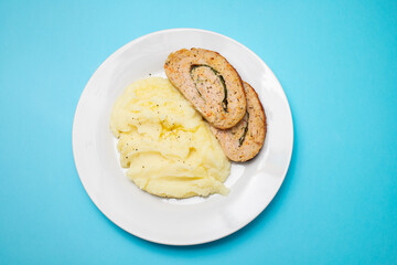 Delicious sliced chicken roll with spinach and cheese and mashed potatos