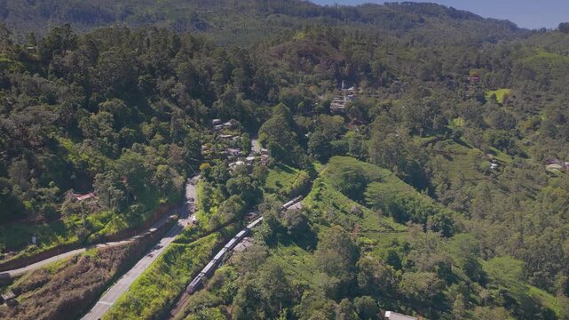 Drone Tracking Shot Following Train Through Greens