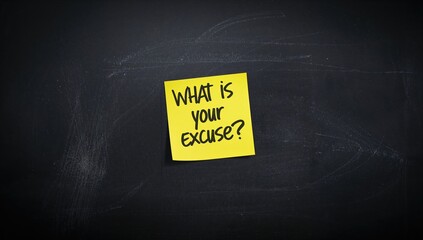 Note written on a sticky note stuck to a slate blackboard, serving as a message display in an educational setting