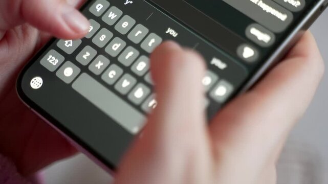 Close up woman hands typing text message on smartphone screen keyboard. Female using mobile phone for chatting, texting, messaging, communication and sending information online.