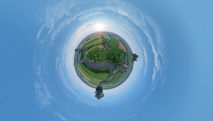 High altitude perspective of rural landscape featuring forest, river, and open fields, highlighting natural terrain