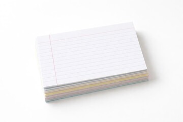Lined index cards stacked on a plain white backdrop perfect for copy space