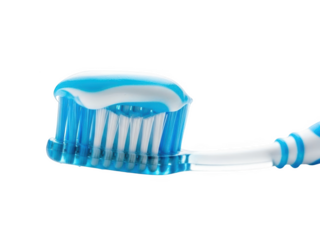 Blue toothbrush with white and blue striped toothpaste on bristles isolated on a transparent background