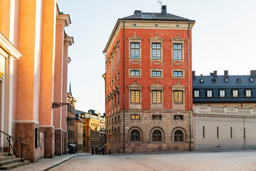 Grand red building with classical architecture in Stockholm's Gamla Stan
