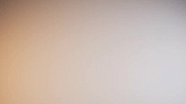 Simple Neutral Gradient: A minimalist visual featuring a subtle gradient of light and shadow, offering a versatile background or texture for various design applications.