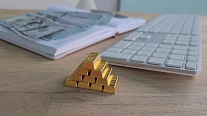 Build wealth with gold bars and cash on the desk showing financial potential