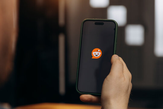 iPhone display with Reddit social media app