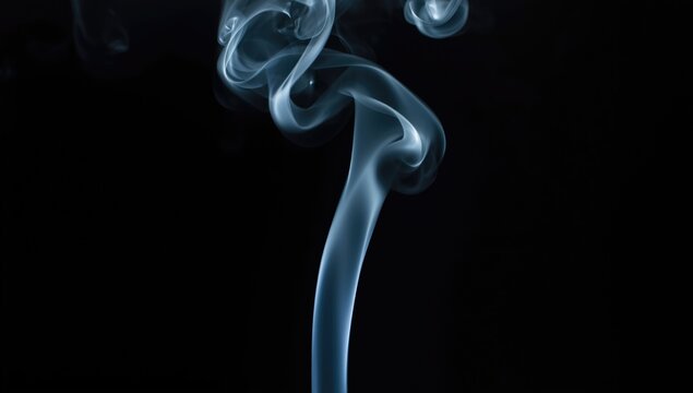 Incense smouldering with white smoke against dark backdrop, serving as a spiritual practice, Earth Day