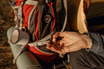 Obraz premium Hand of traveling man with mudra meditating during yoga in nature 