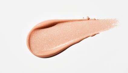 Fototapeta premium Creamy luminous blusher in light beige on white surface, used for facial makeup enhancement