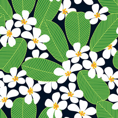 Vector seamless pattern with white exotic flowers and vibrant green foliage