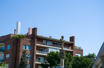 Residential building with statue and clear blue sky