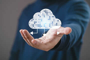 Cloud computing technology concept with hand holding digital cloud and data transfer arrows. Online storage, data management, network connectivity, cybersecurity and modern IT infrastructure solution.