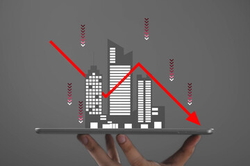 Digital illustration of a falling stock market graph over a modern city on tablet screen, representing economic downturn, financial crisis, business risk, recession, and global market decline.