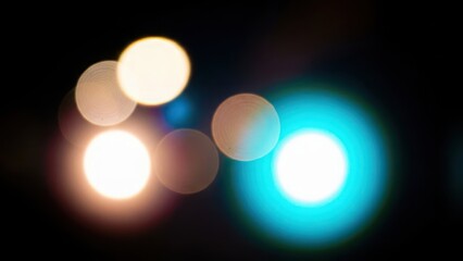 Vibrant bokeh lights in warm and cool tones on a dark background
