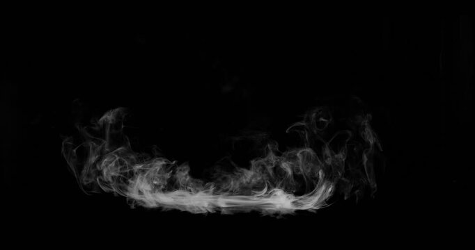 Super Slow Motion of White Surface Smoke Texture Isolated on Black Background. Filmed on High Speed Cinema Camera, 500fps. VFX element for overlay.