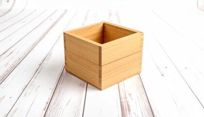 Wooden Square Container Resting on White, Textured Surface.