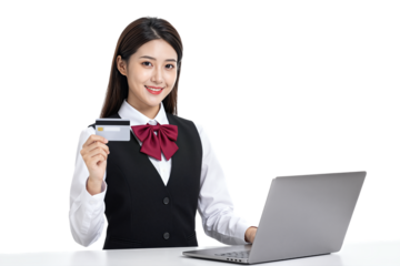 Young Asian woman in uniform holding credit card near laptop